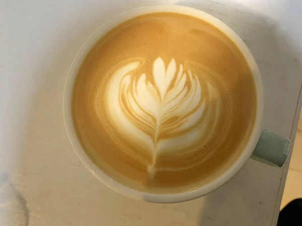 a cup of coffee with a white background