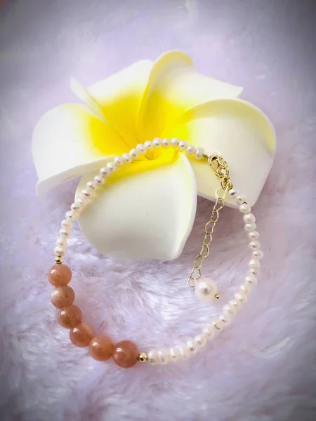 white pearl necklace with pearls on a background