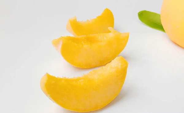 fresh ripe mango slices on white background