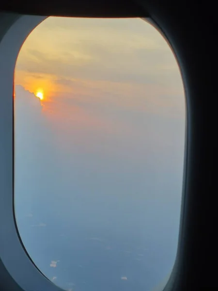 airplane window in the sky