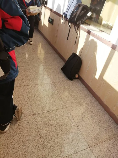 man with a bag of wine in the airport