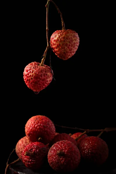 fresh red berries on black background