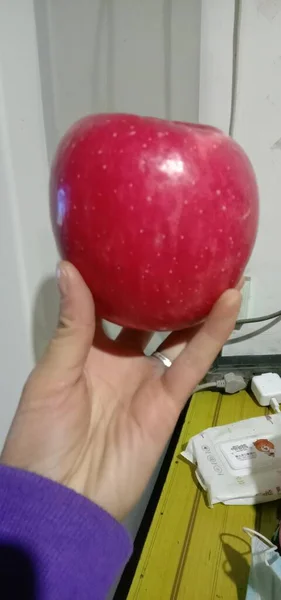 red apple with a white sheet of a woman