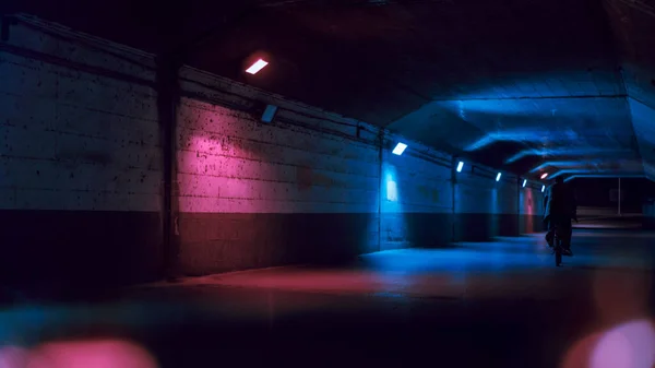 underground tunnel with lights and neon light