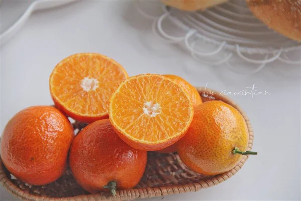 fresh orange and white fruit on a kitchen table