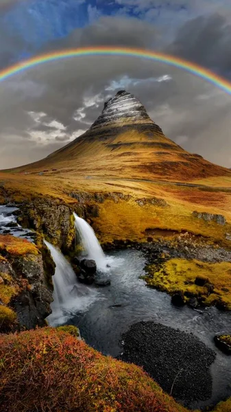 beautiful view of the icelandic landscape with a waterfall in the background