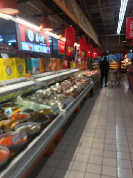 blurred background of supermarket and food store