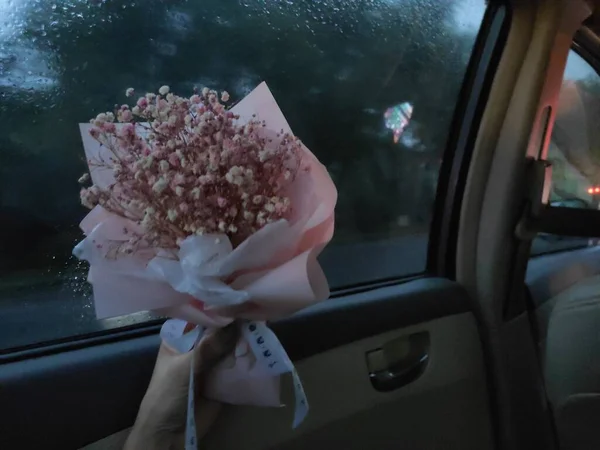 beautiful wedding bouquet of roses in the car