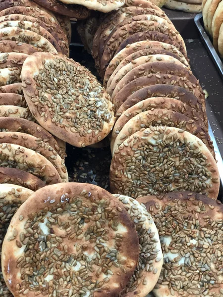 freshly baked bread rolls on a market stall