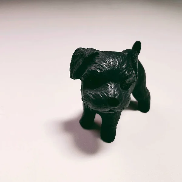 a toy dog on a white background