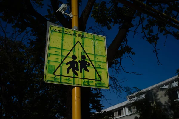 street sign with a lot of people signs