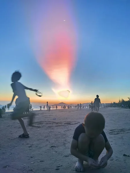 silhouette of a man and woman on the beach