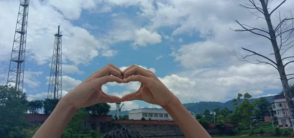 heart shape in hand on the roof of the city