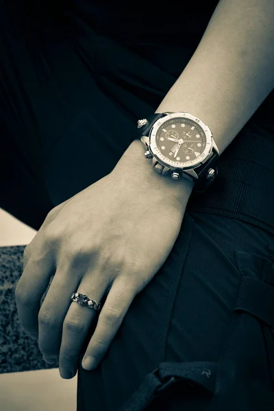 man\'s hands with watch on wrist watches