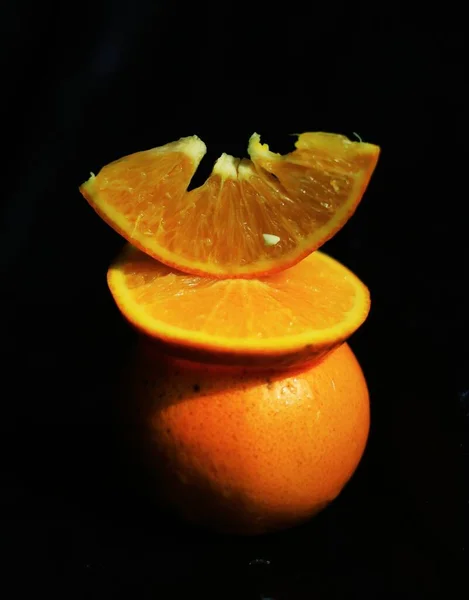orange and black background with a slice of lemon
