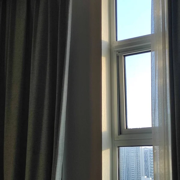 window with a white curtain