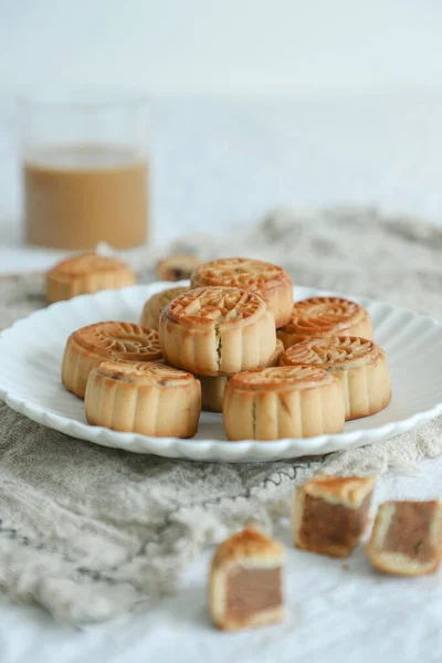 delicious homemade cookies with cream and nuts on a white plate