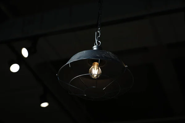 light bulb hanging on ceiling, closeup