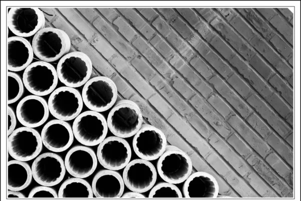 metal pipes in the form of a pile of concrete.