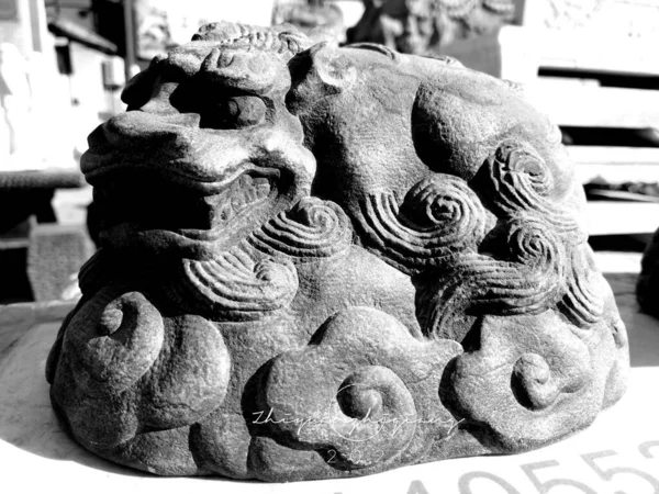 black and white image of a stone sculpture