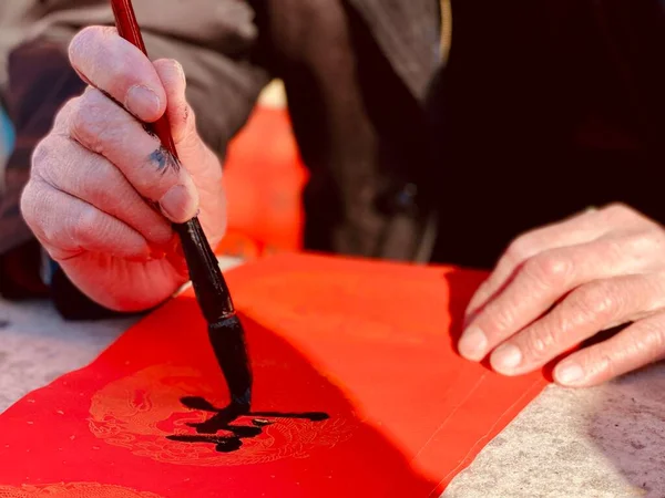 close up of a man\'s hand with a tattoo on the table