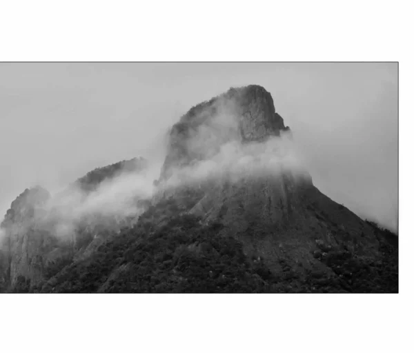 black and white photo of a mountain