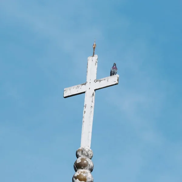 cross-shaped bell in the sky