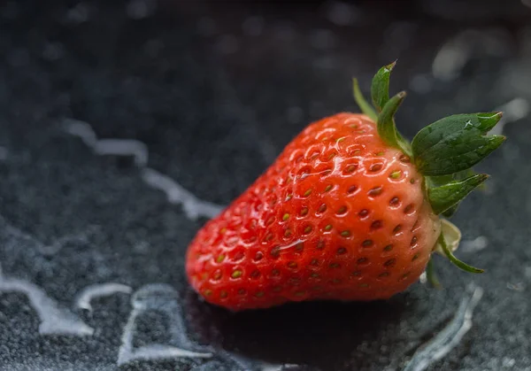 fresh strawberries on a black background