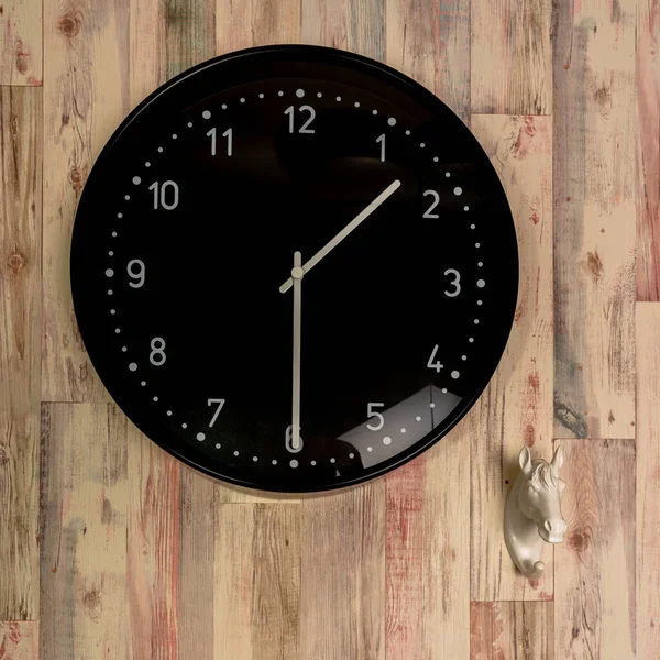 old wooden clock on a black background