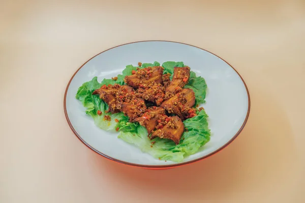 fried fish with vegetables and sauce