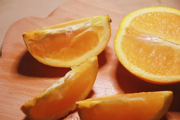 sliced orange slices on a wooden background