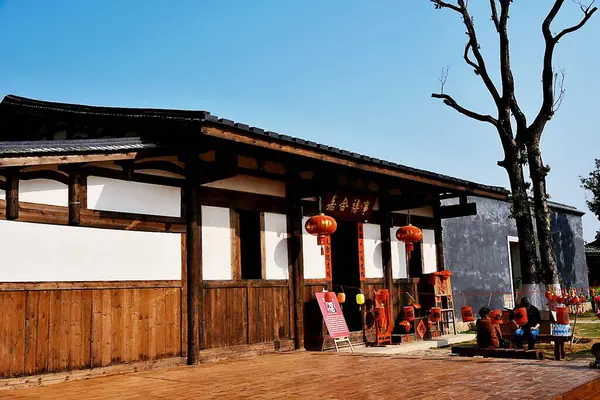 stock image the old wooden house in the city