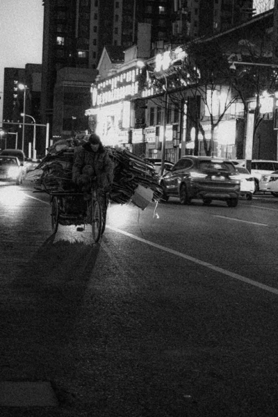 black and white photo of a street in the city