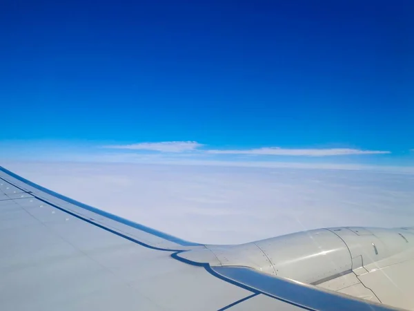 wing of a plane in the sky