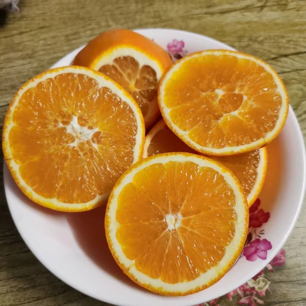 sliced orange and lemon slices on a wooden table