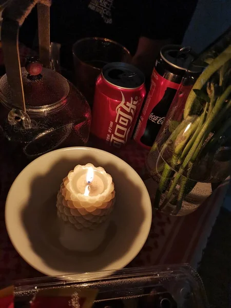 a closeup shot of a candle in a restaurant