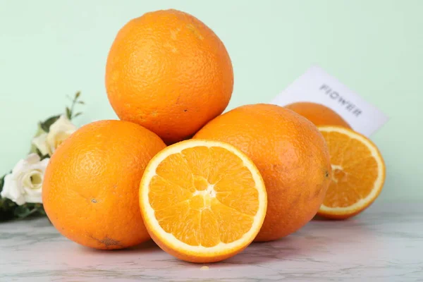 fresh ripe oranges and orange on white background