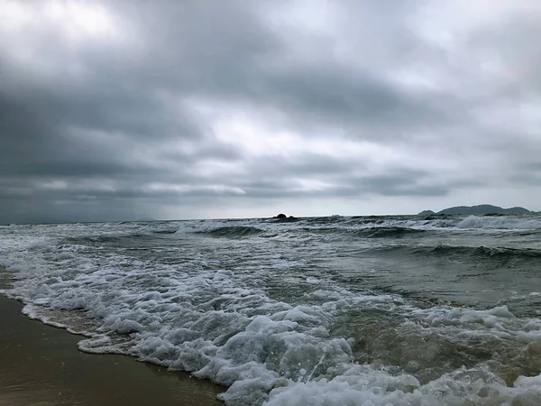 stormy weather, waves and clouds in the sea