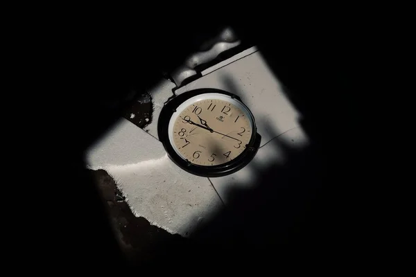 old clock on a black background