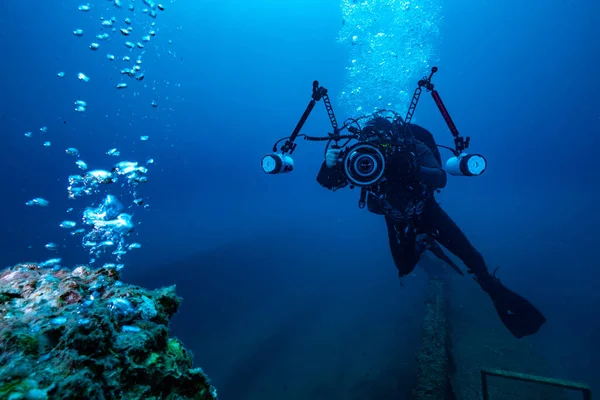 underwater scene with diver and scuba diving
