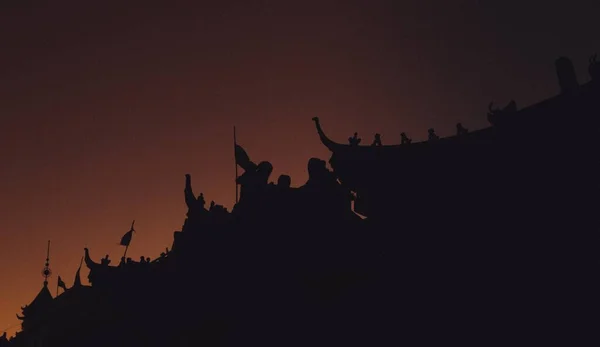 silhouette of the dragon on the roof of the castle