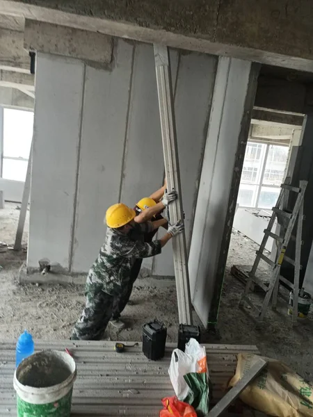 construction worker with a hammer and a glass of water