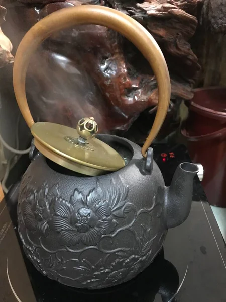 old ceramic teapot on the table