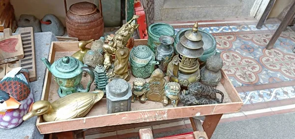 traditional thai style, handmade, wooden souvenirs, a souvenir shop, a lot of different types of things