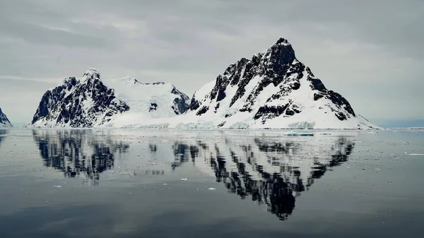 antarctic landscape with iceberg and snow