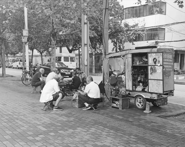 black and white photo of a man and woman in a street