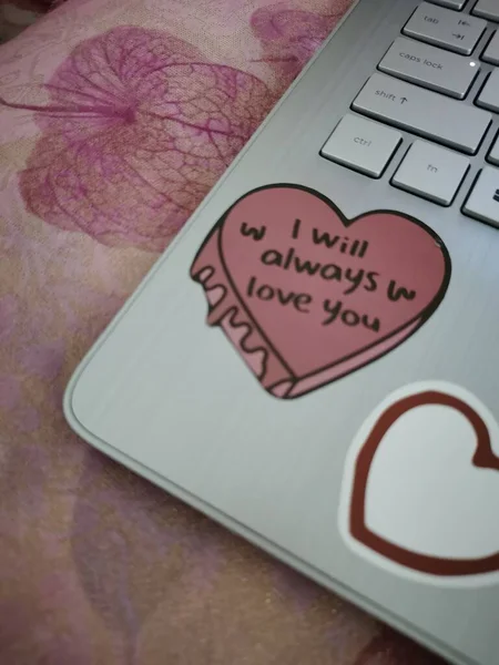 love message on laptop keyboard with heart symbol