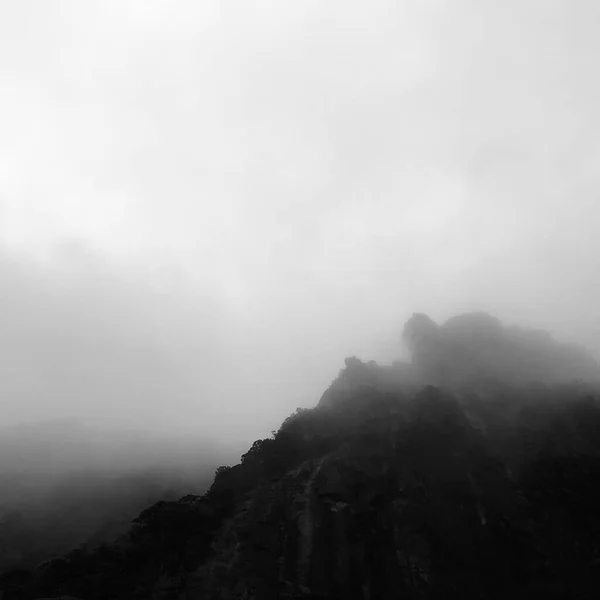 black and white clouds in the mountains