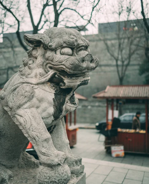 the statue of the lion in the park