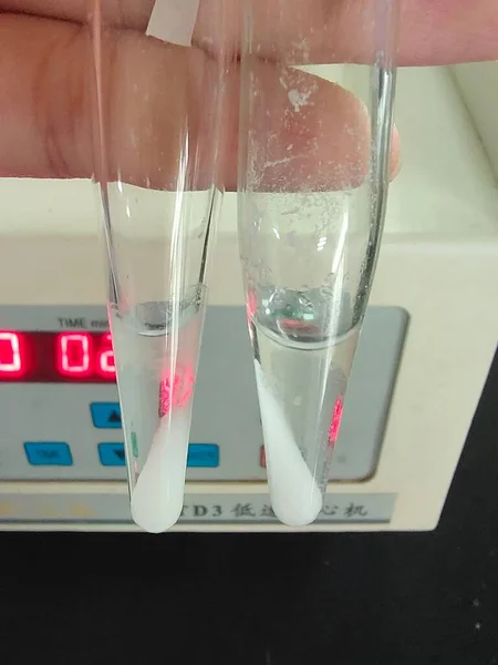 a glass of water with a test tube